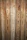 Vertical wooden planks with distinct grain patterns and knots, featuring a natural and rustic appearance.