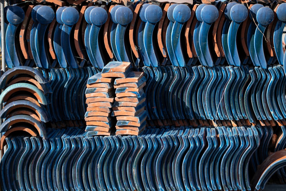 a pile of blue and brown plates stacked on top of each other