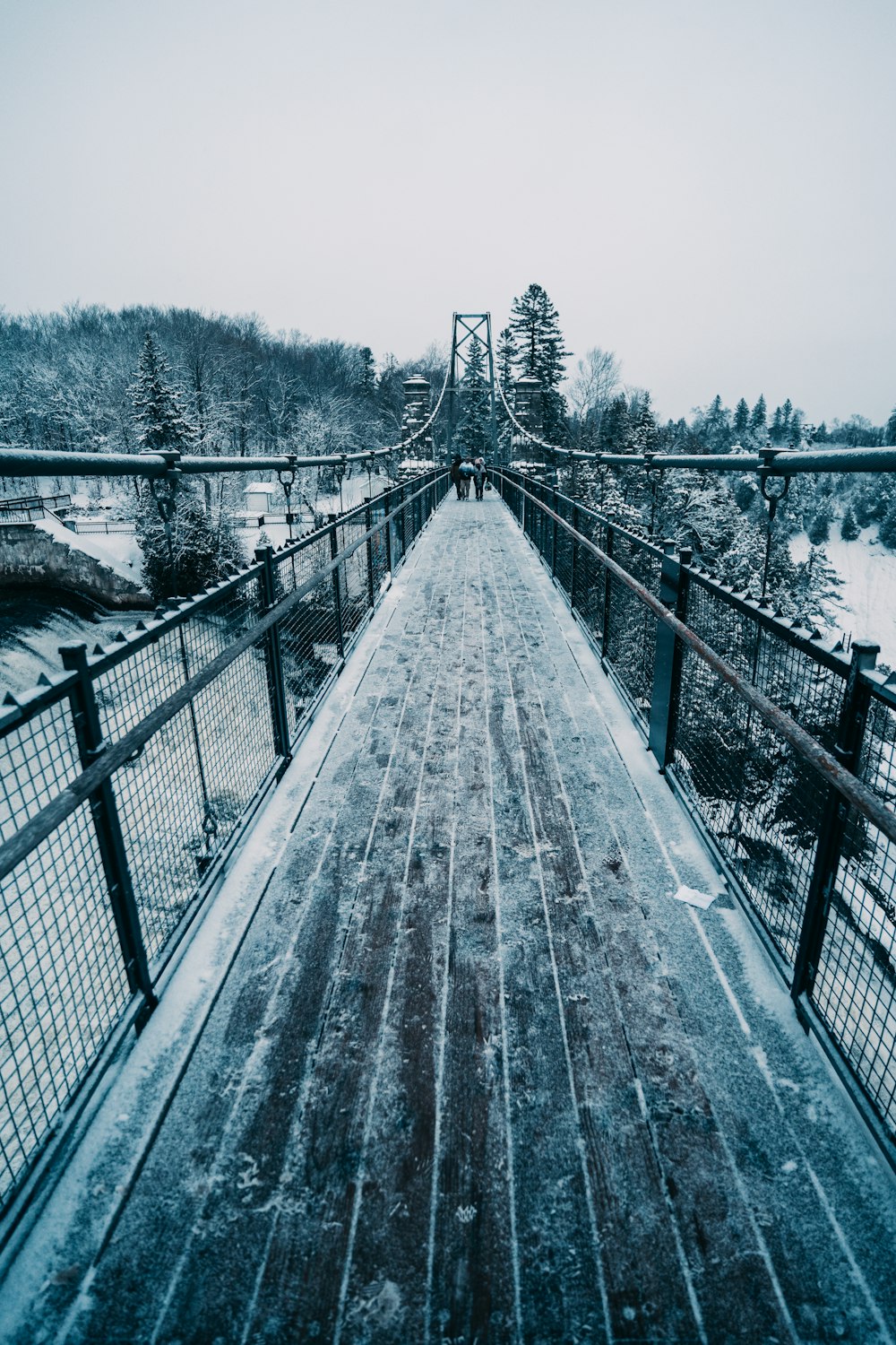 a bridge that has snow on the ground