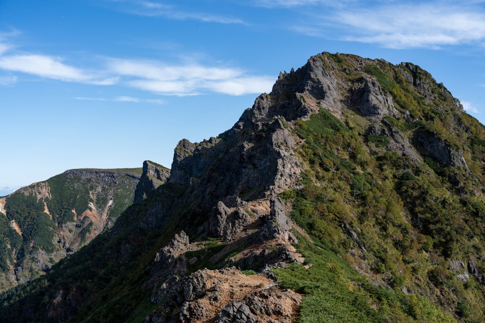 a very tall mountain with a very steep side