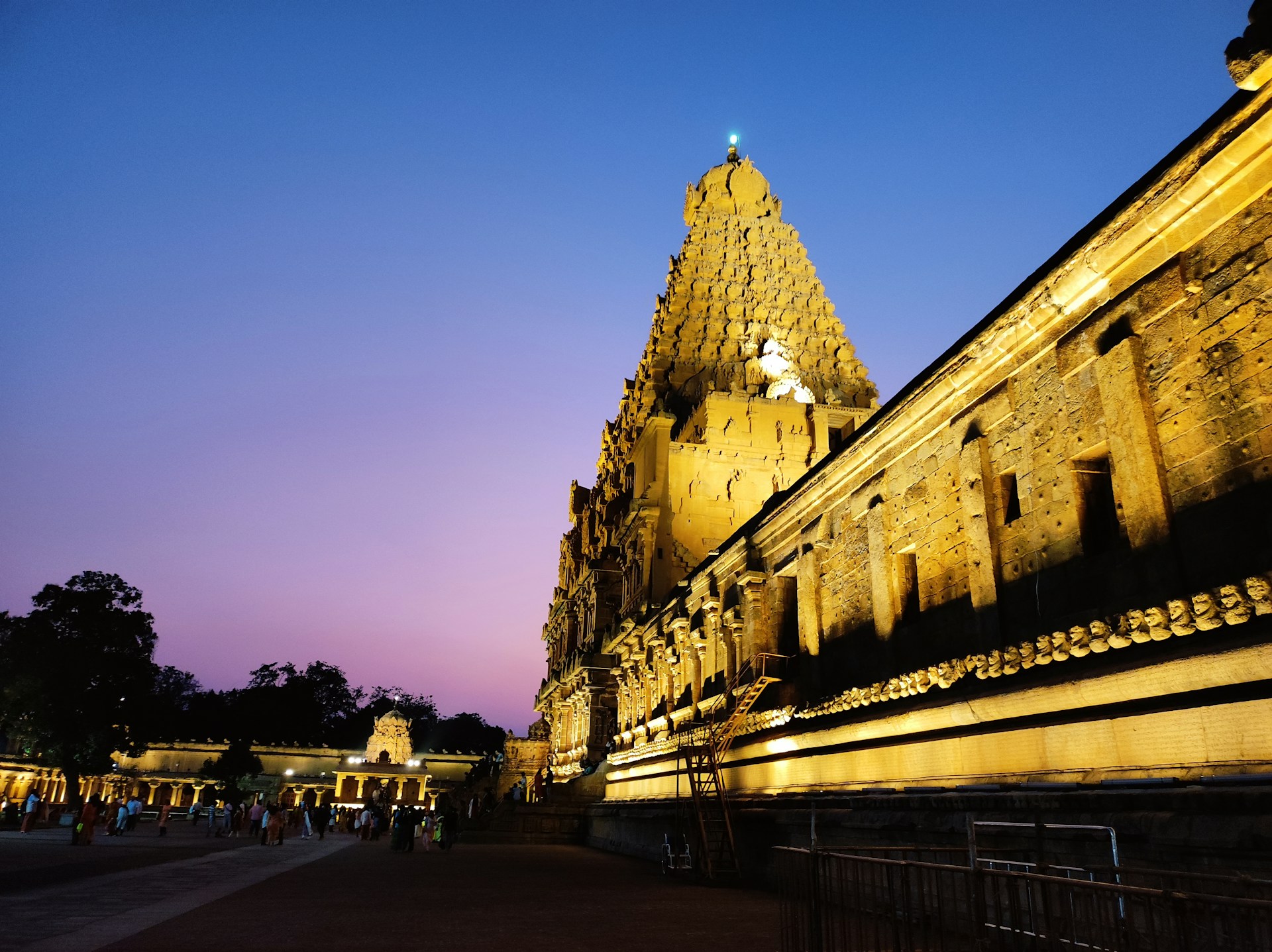 woman wearing yellow long-sleeved dress under white clouds and blue sky during daytime