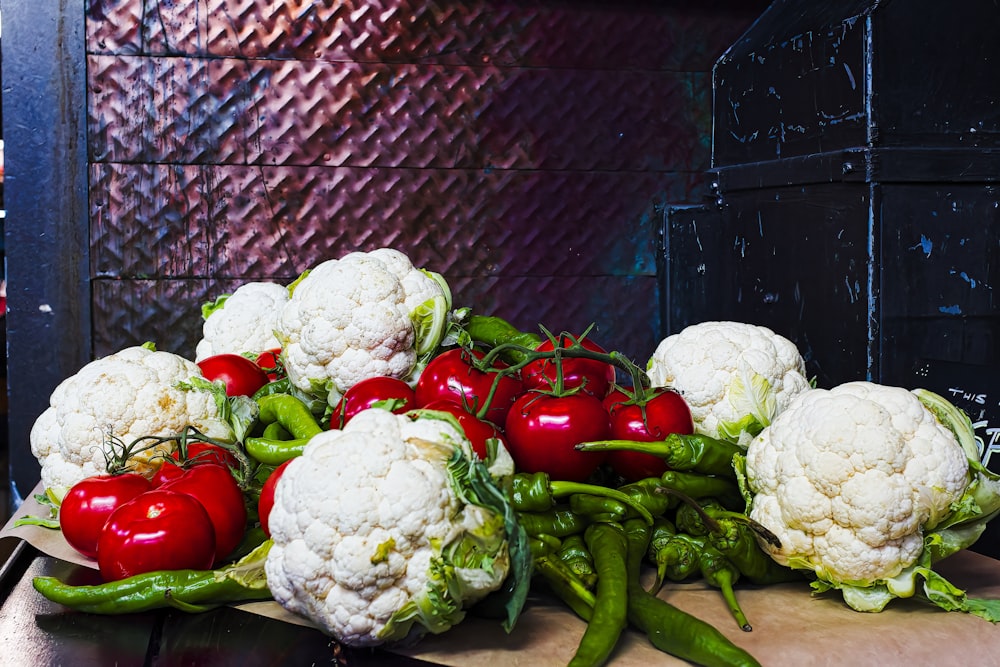 a pile of cauliflower and peppers on a table