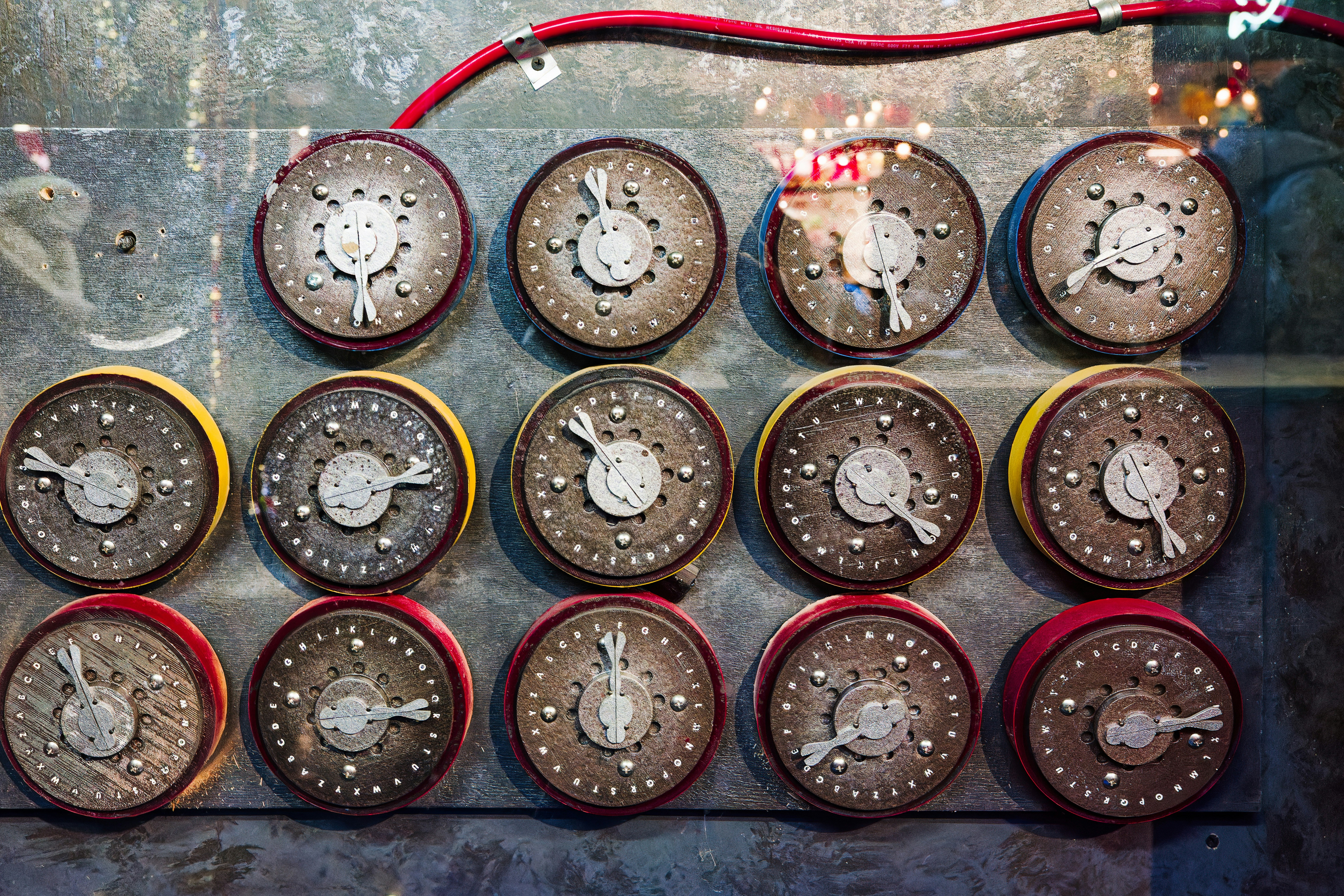 a bunch of clocks that are on a wall
