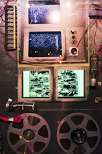 A vintage film reel intertwined with digital code streams representing AI technology.