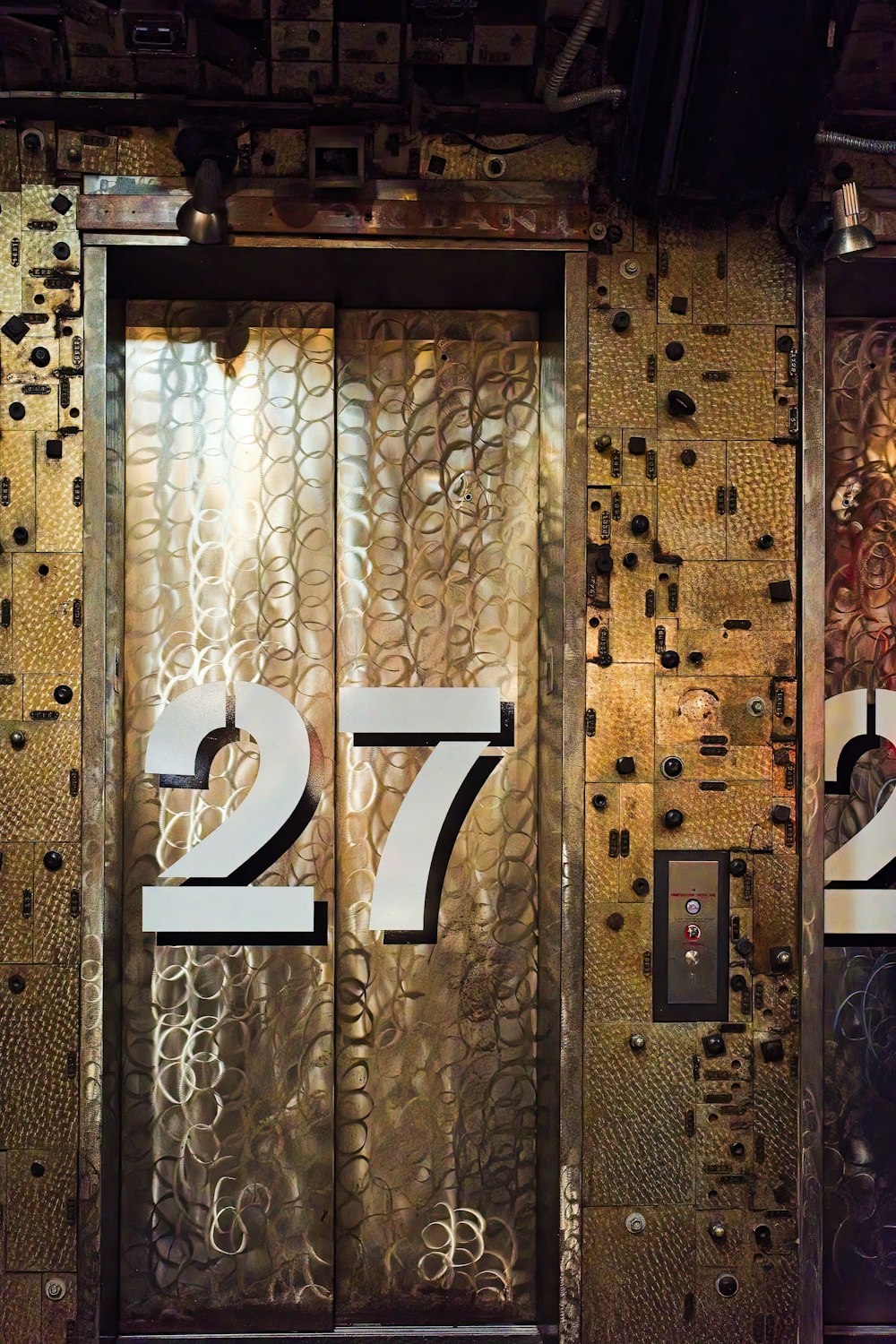 a large metal door with numbers on it