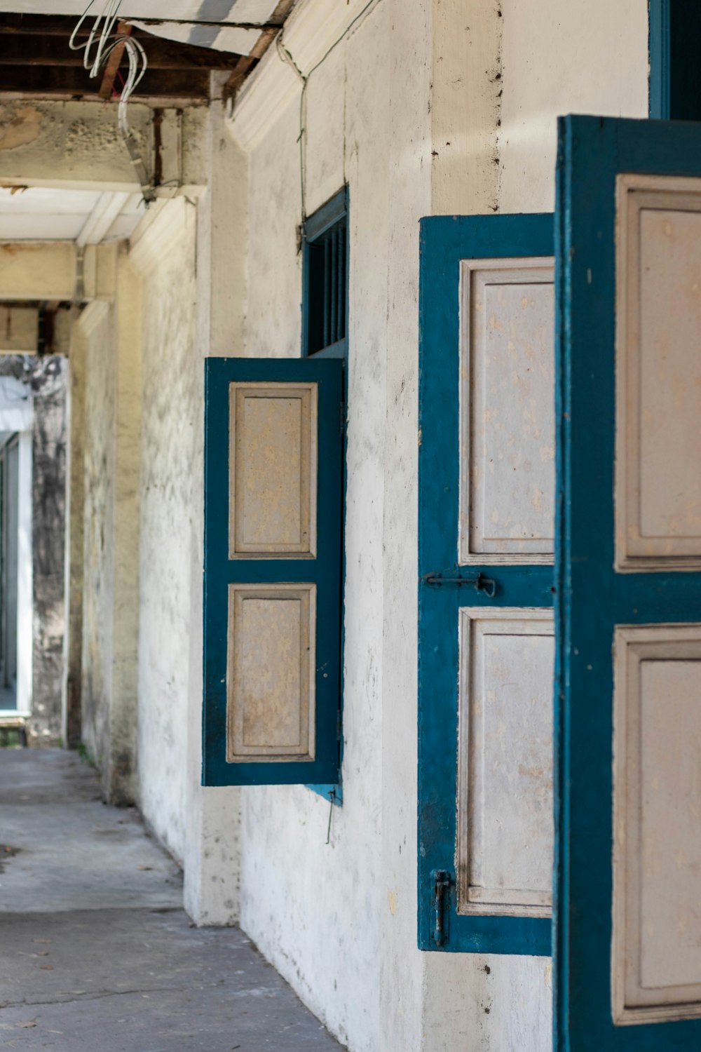 an old building with a blue door and window