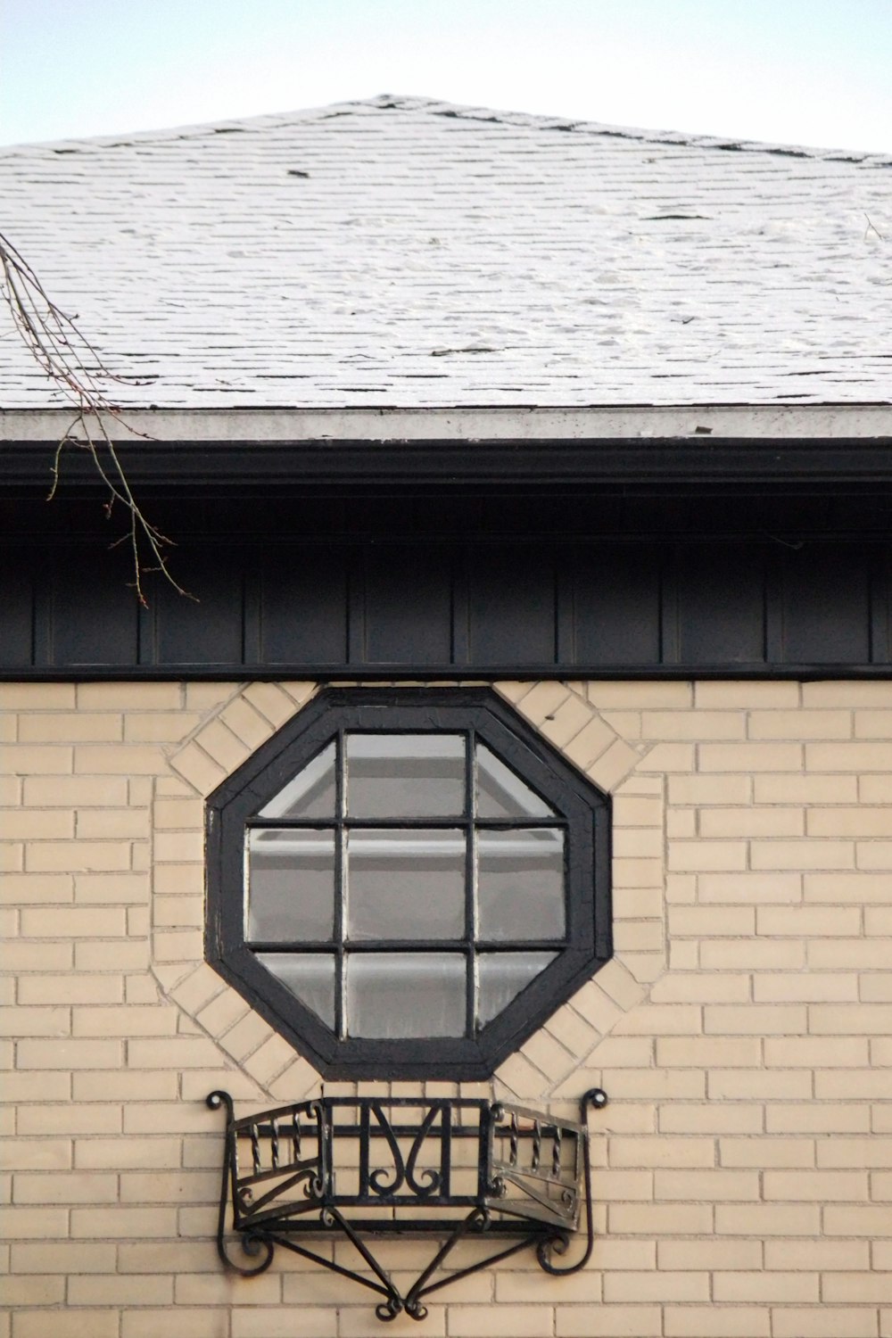 a window on the side of a brick building