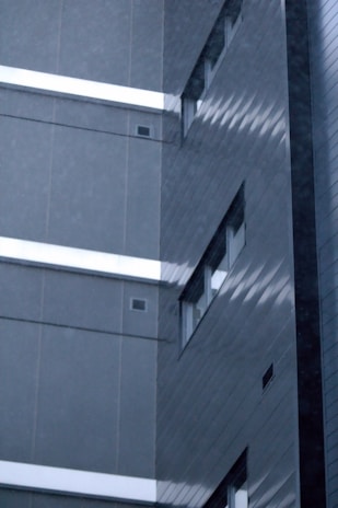 a tall building with a clock on the side of it