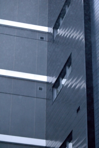 A modern aluminum facade on a commercial building showcasing sleek design and craftsmanship.