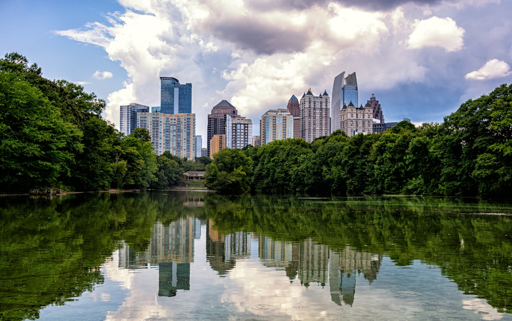 a body of water with a city in the background