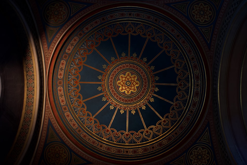 a ceiling in a building with a clock on it