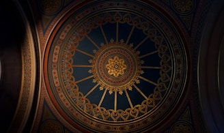 a ceiling in a building with a clock on it