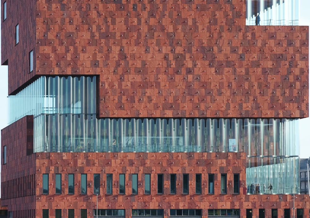 a red brick building with a clock on the front of it