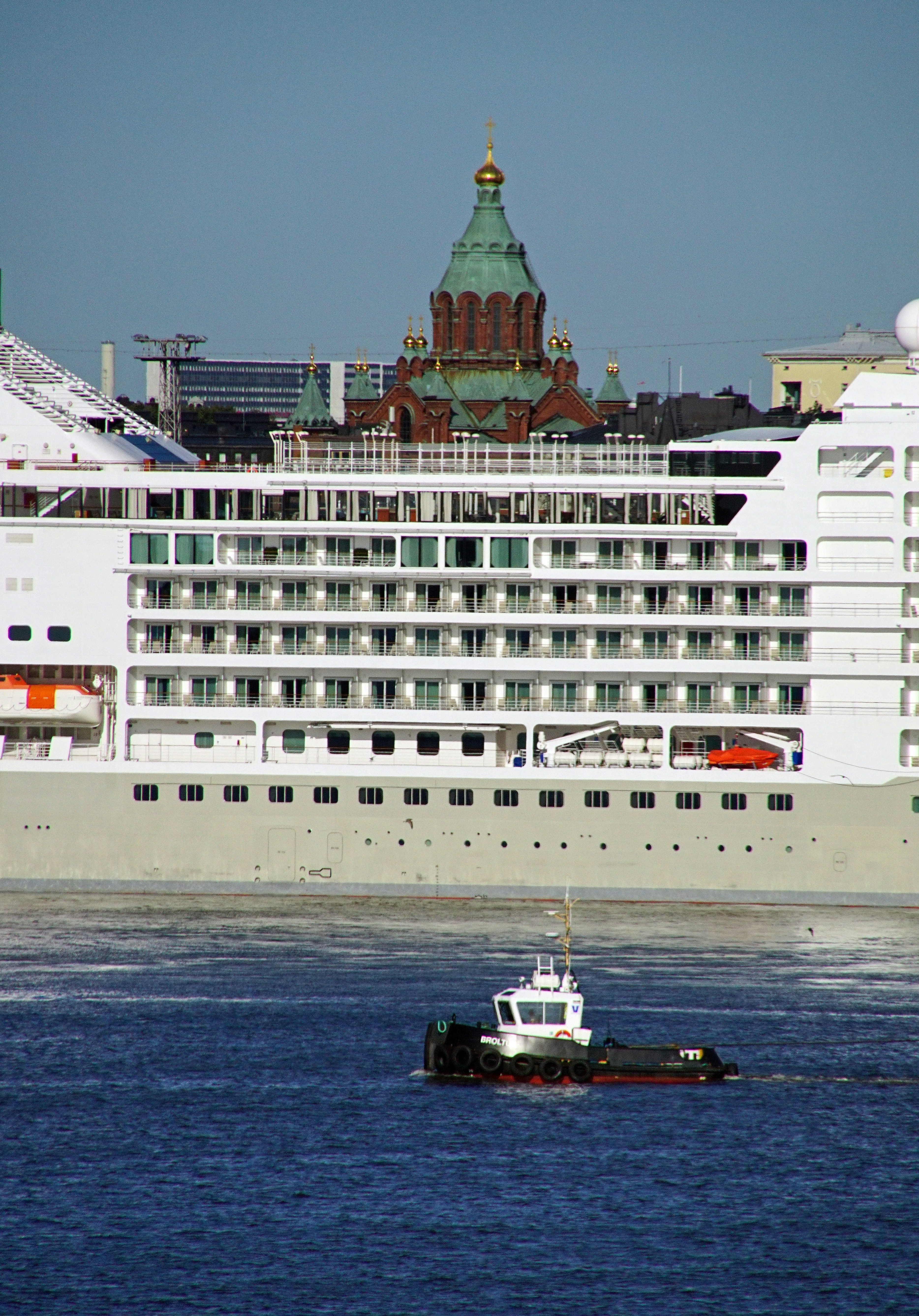 A large cruise ship in a body of water