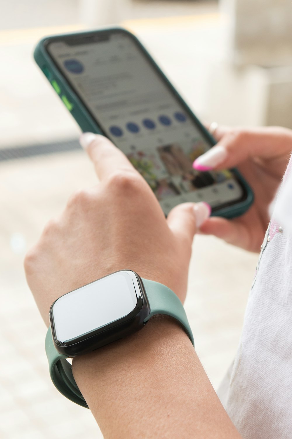 a woman holding a smart phone in her hand