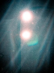 Light beams piercing through a misty silver gradient, evoking supreme intelligence.