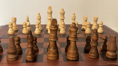 A colorful chessboard with pieces arranged for a beginner lesson.