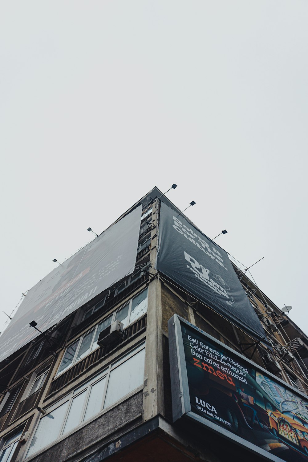 a tall building with a sign on the side of it