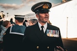 A proud navy veteran in a professional setting.