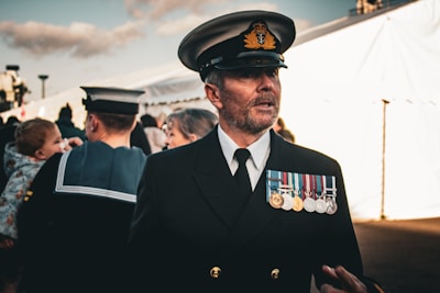 A proud navy veteran in a professional setting.