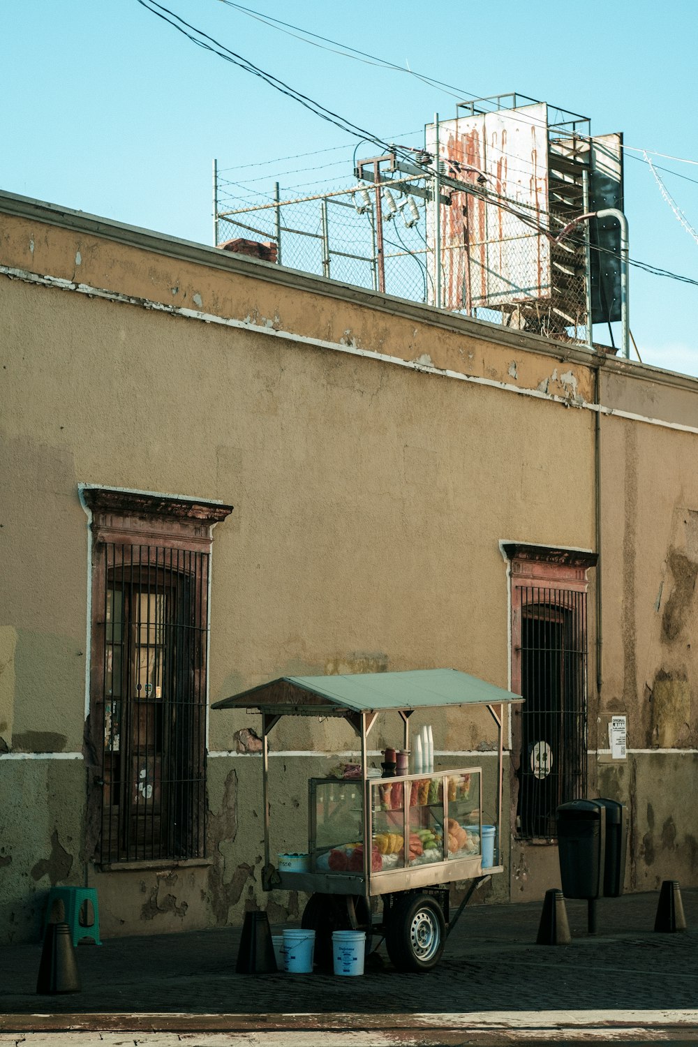 a food cart parked in front of a building