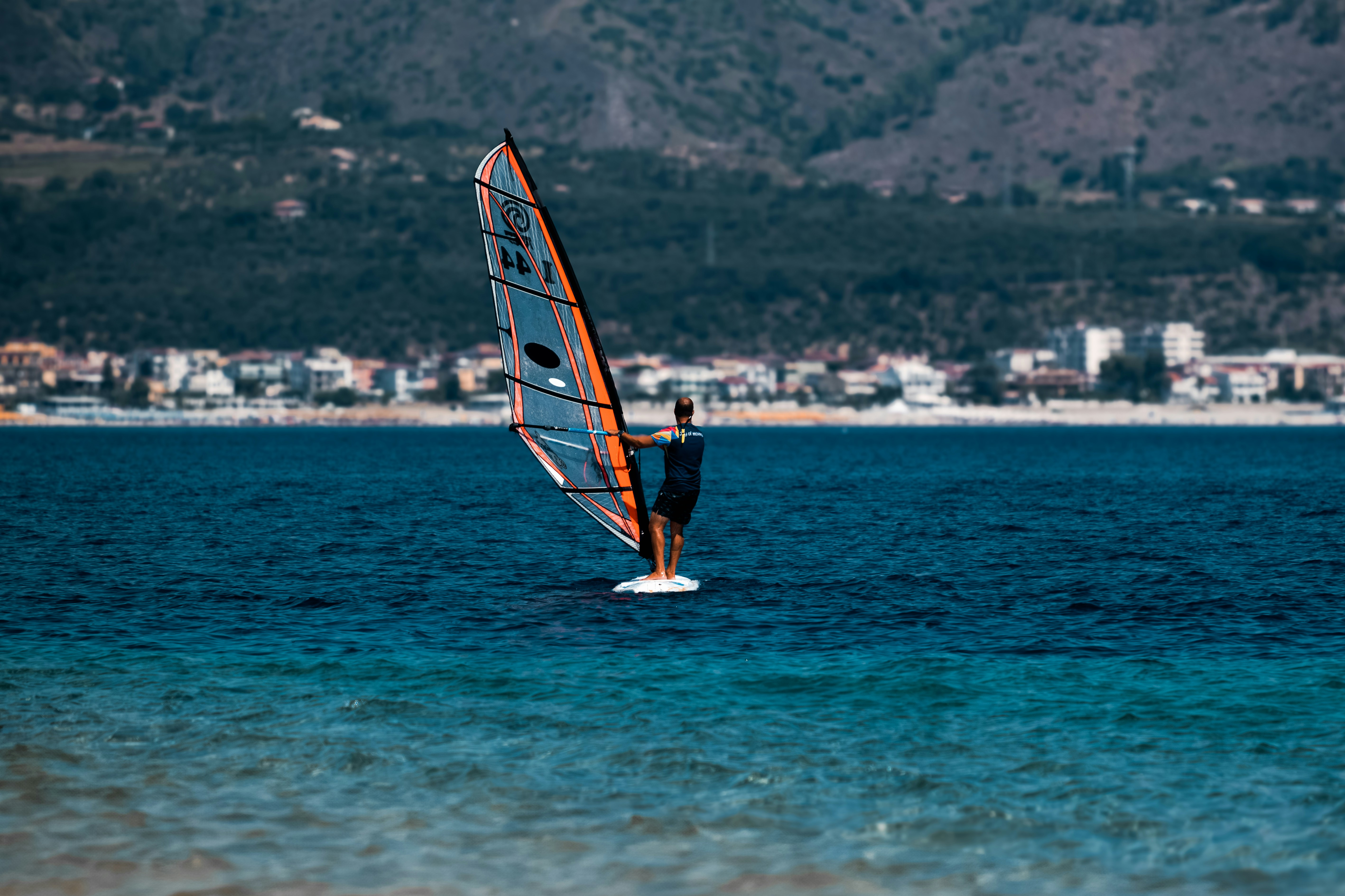"Feel the thrill of windsurfing in Soverato's crystal-clear waters, where the wind and waves create the perfect playground."