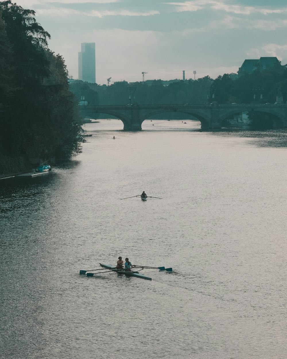 a couple of people in a boat on a body of water