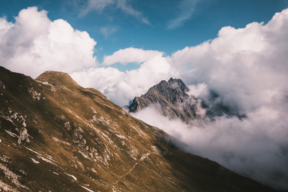 a view of a mountain with clouds in the sky