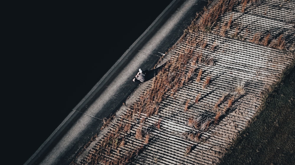 an aerial view of a train track in the middle of a field