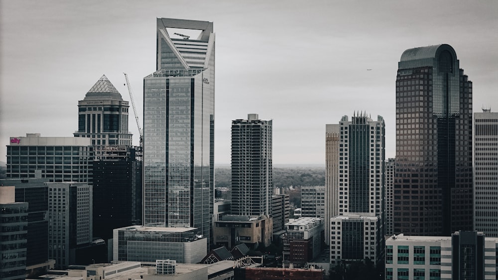 a black and white photo of a city with tall buildings