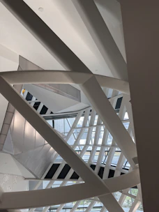 Structural engineers reviewing reinforced concrete beams and steel framing in a sleek digital workspace.