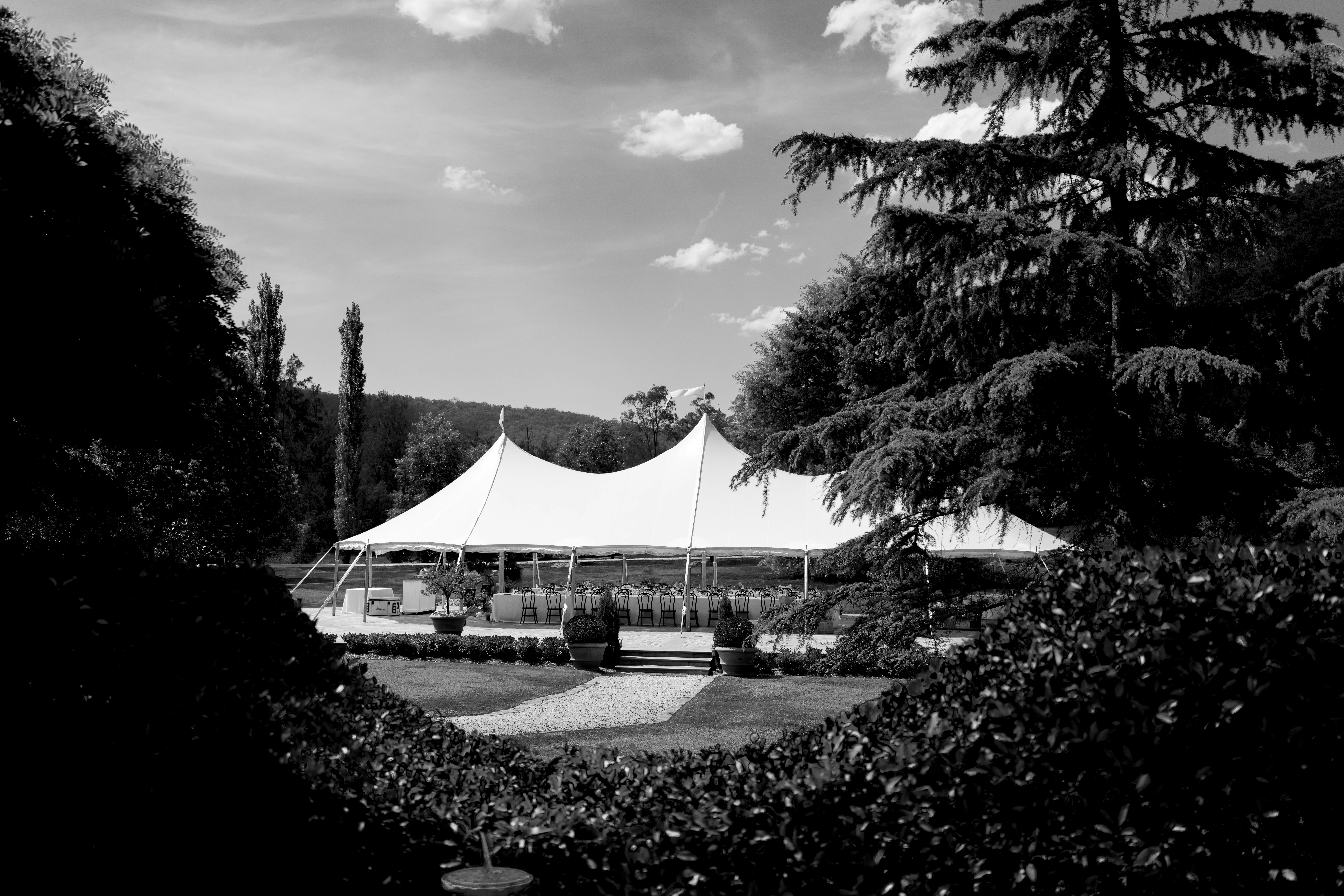 a large tent set up in the middle of a field