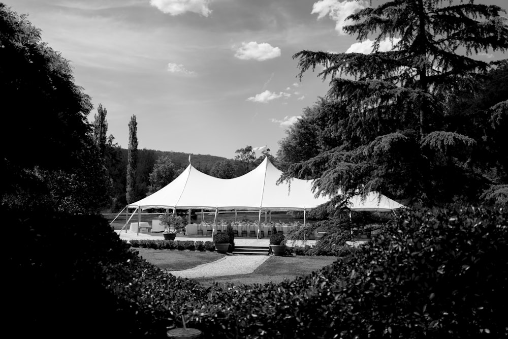 a large tent set up in the middle of a field