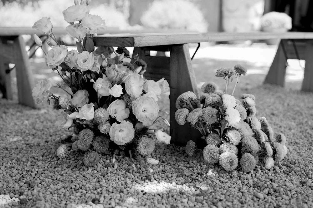 a bunch of flowers that are sitting on the ground