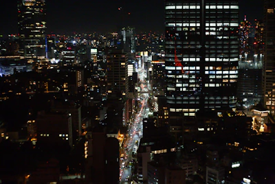 A bustling cityscape at night with illuminated skyscrapers