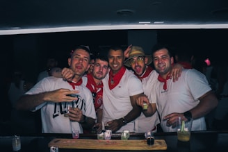 A lively gathering of people tasting Chinese baijiu at a cultural exchange event.