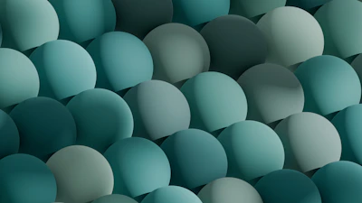 Abstract gradient overlay blending teal and lavender hues with soft geometric shapes.