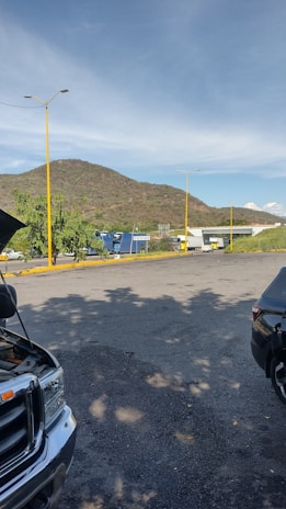 A secure parking area with 24-hour monitoring, nestled among Patagonian trees and mountains.