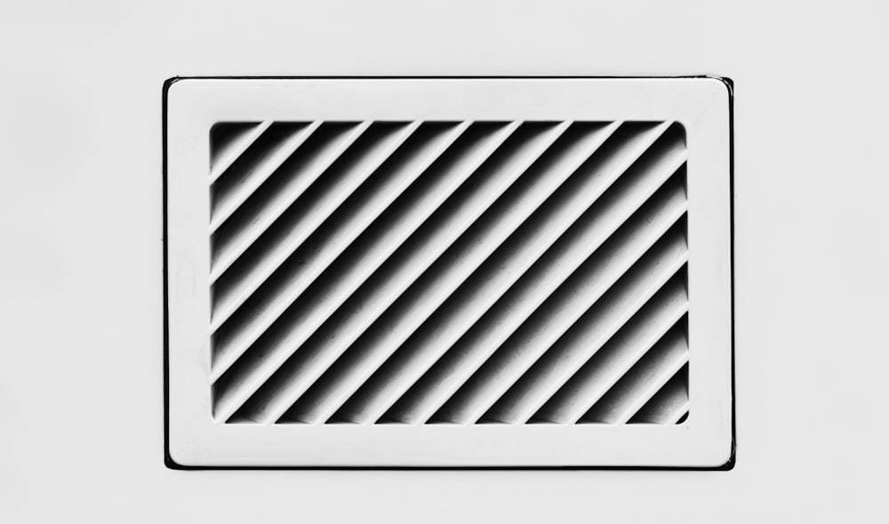 a close up of a vent in a wall