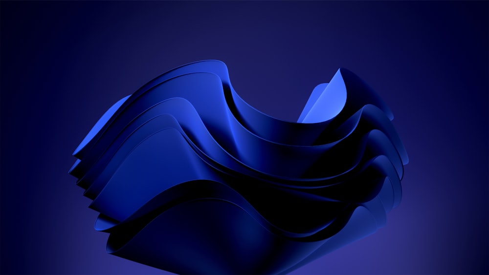an abstract blue background with wavy shapes