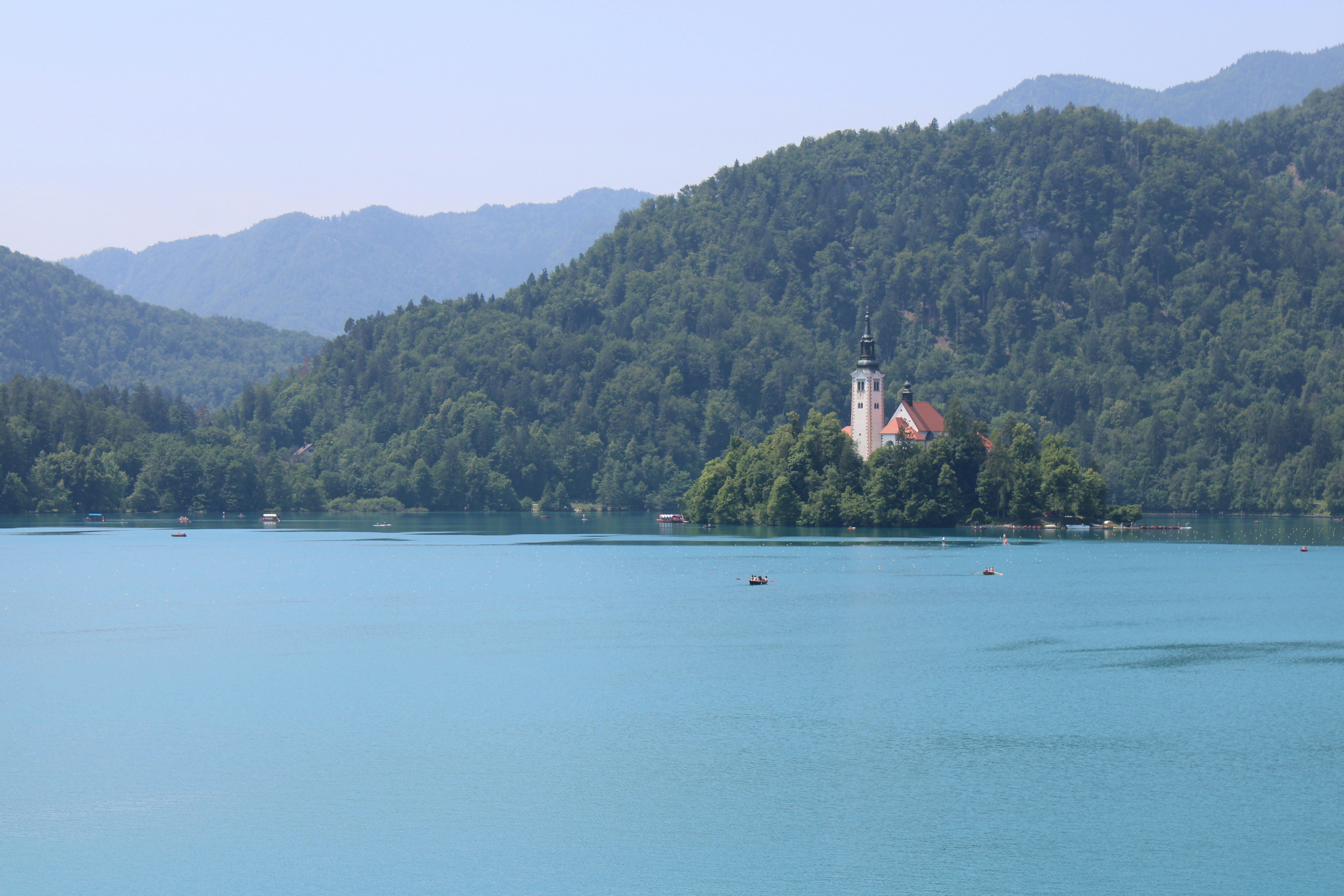 a church on a small island in the middle of a lake