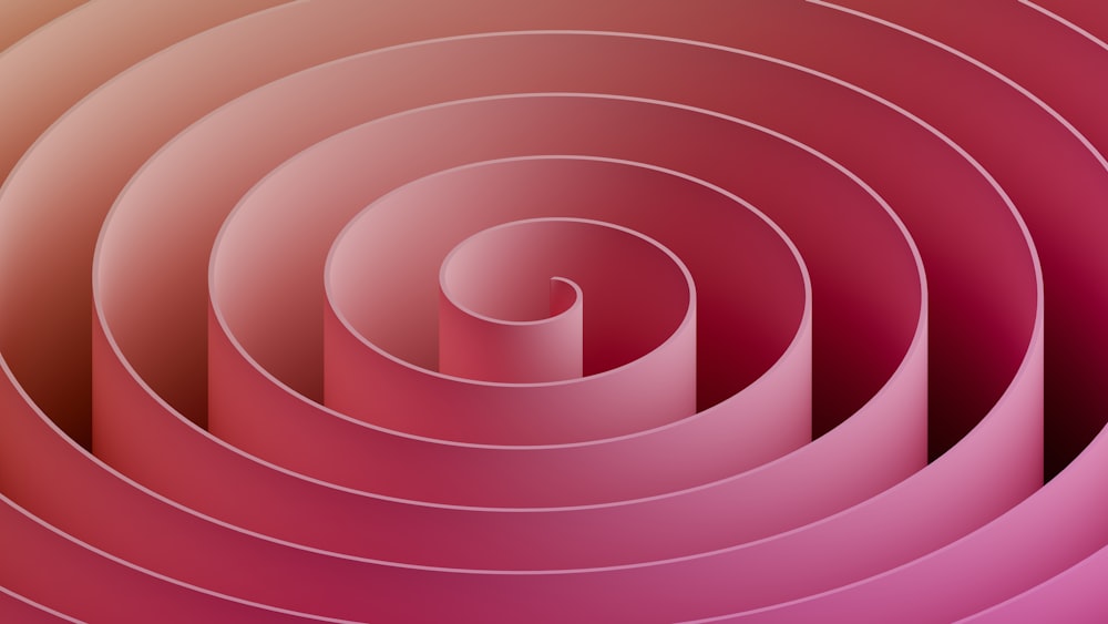a pink and red background with a spiral design