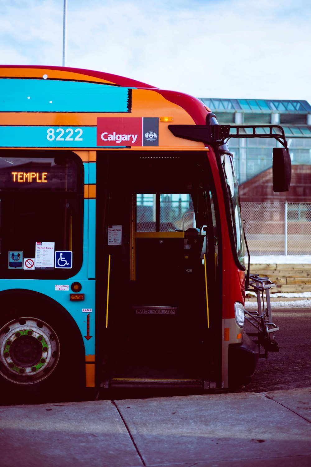 a colorful bus parked on the side of the road