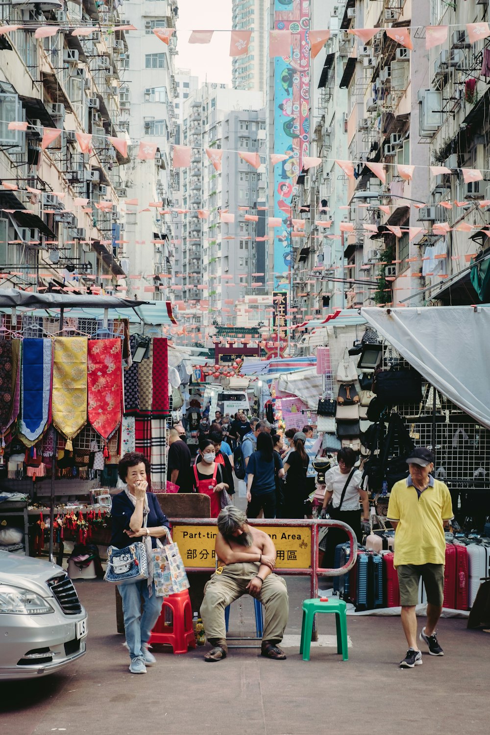 a group of people standing around a market