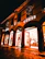 Evening exterior shot of the store with warm lights glowing invitingly.