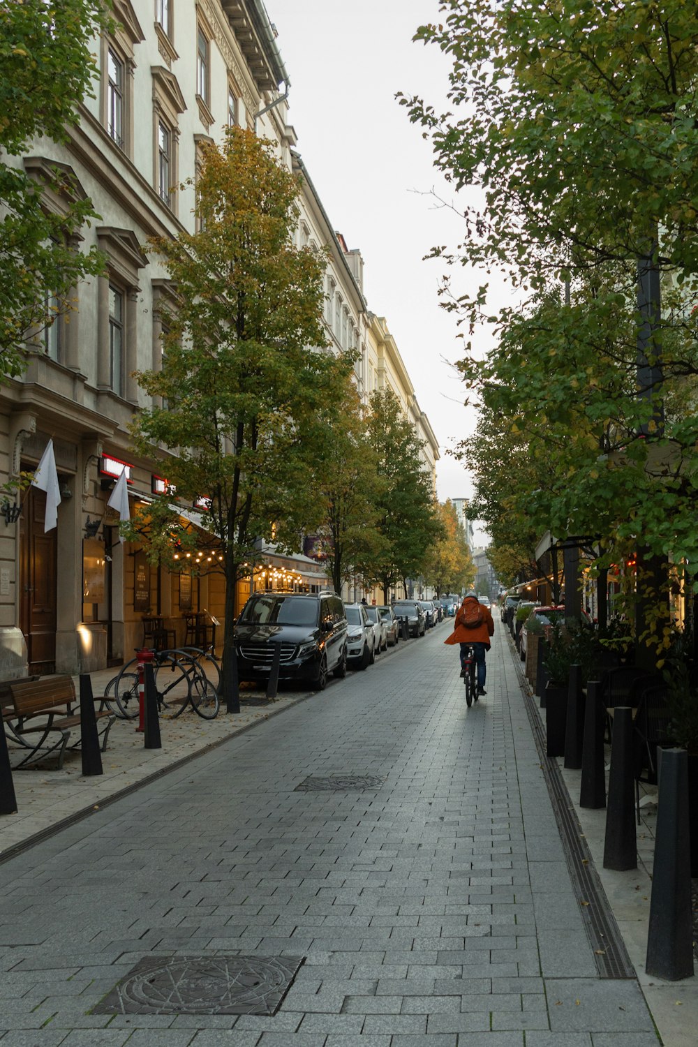 a person riding a bike down a street