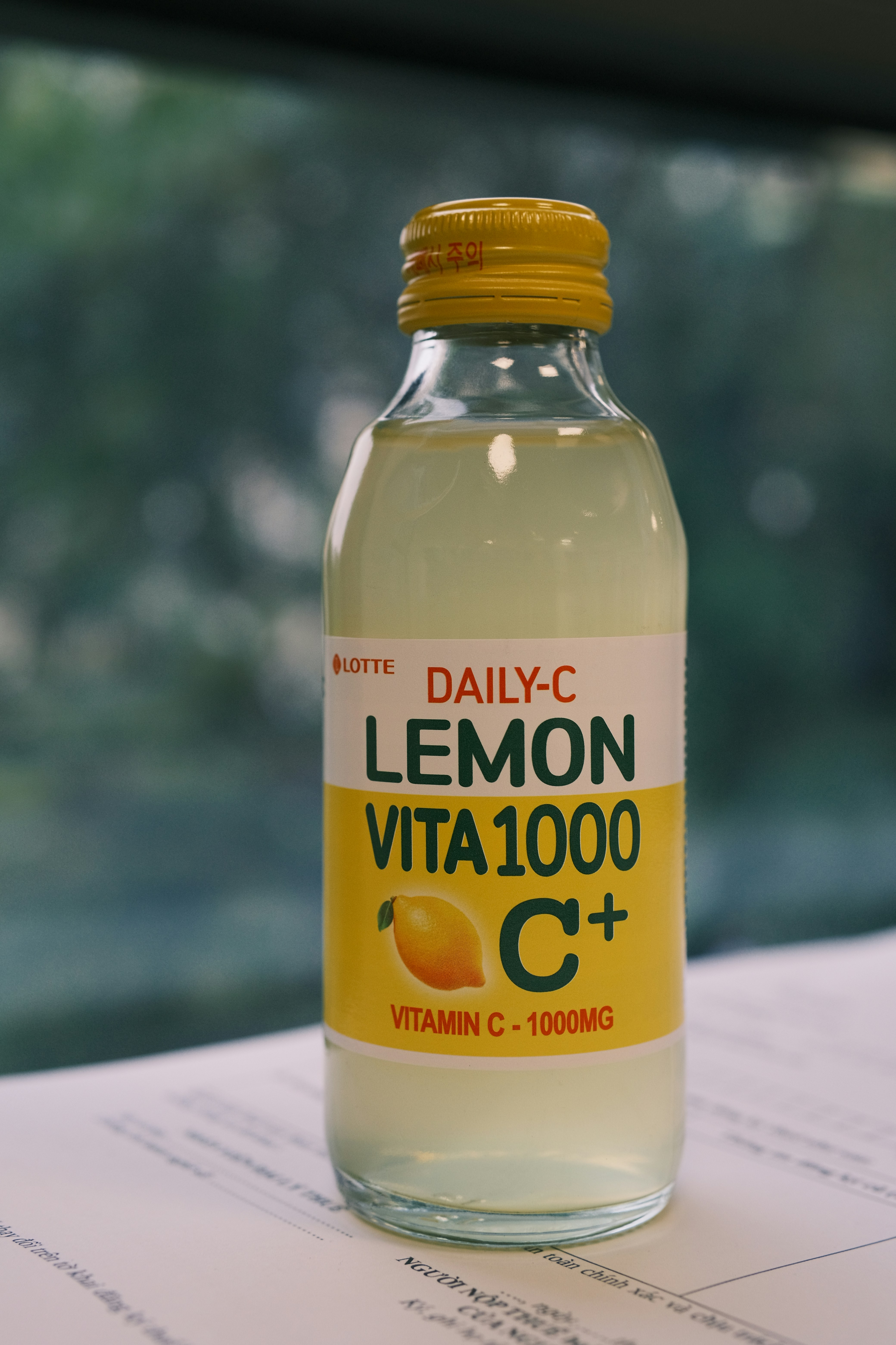 a bottle of lemon vitamin water sitting on top of a table