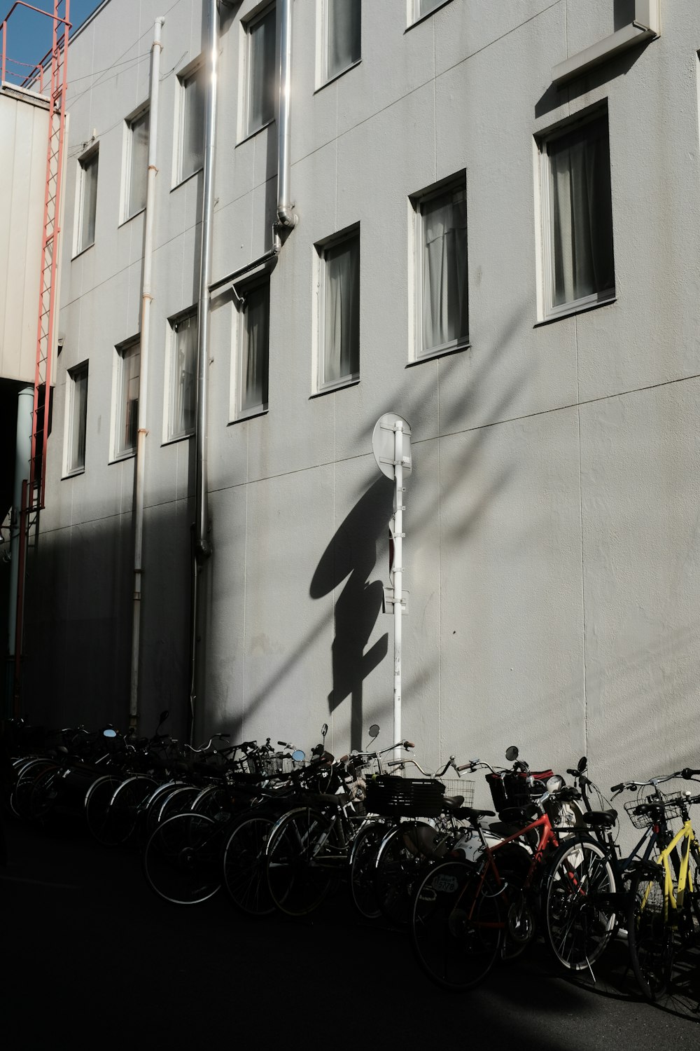 a bunch of bikes parked in front of a building