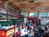 People happily discussing their meal choices at a cafe.