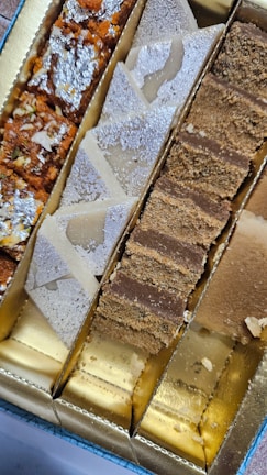 Assortment of South Asian sweets arranged on a traditional platter.